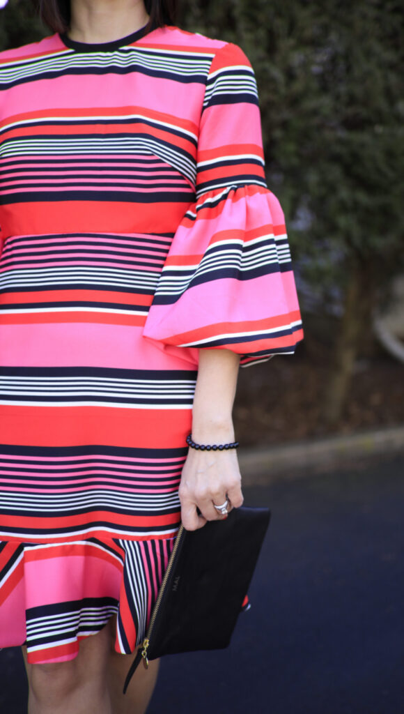 Pink and Black Stripe Dress Standing Out in a Crowd
