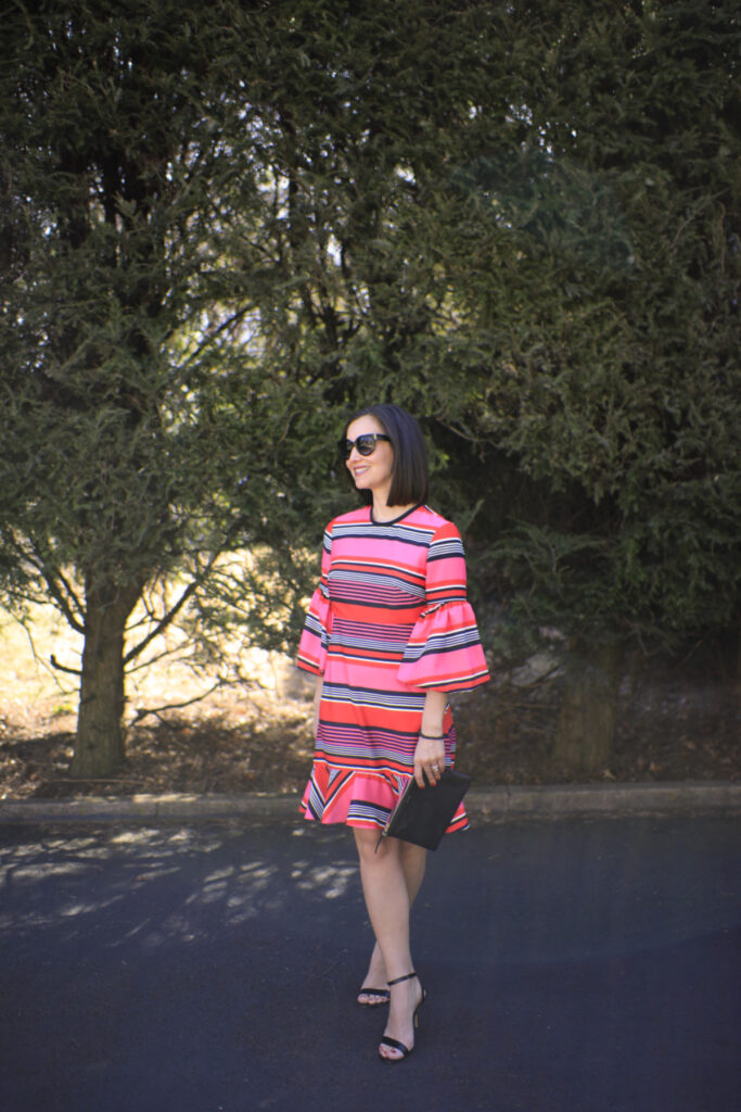 Pink and Black Stripe Dress Standing Out in a Crowd